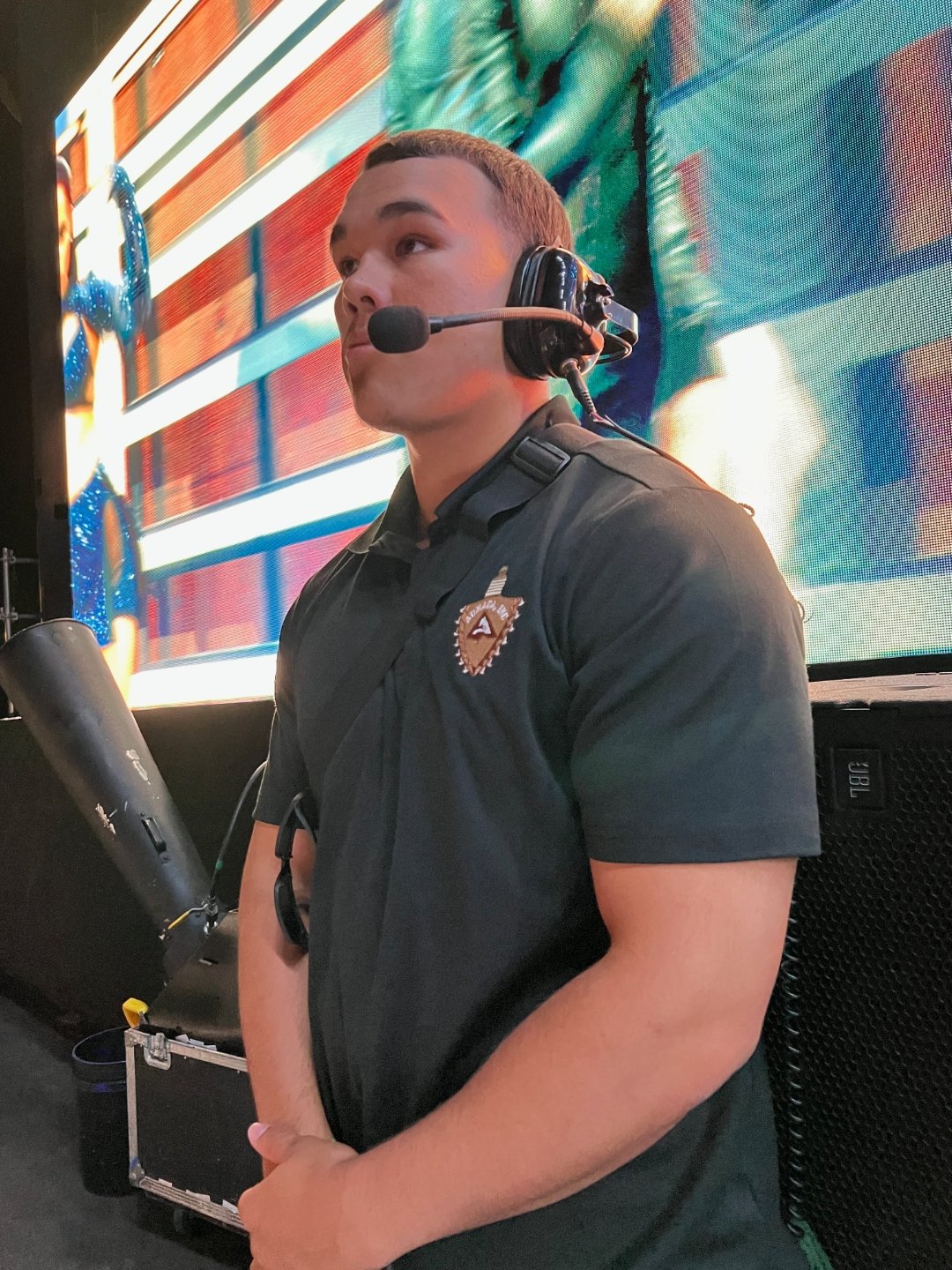 An independent contractor working event production with a headset mic